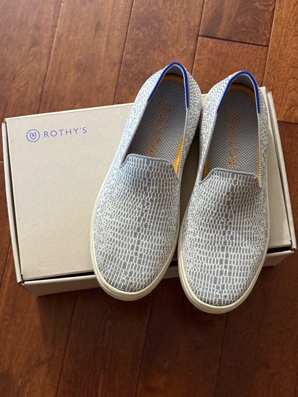 Rothy's Women's Slip-On Sneakers in Light Gray with Blue Trim